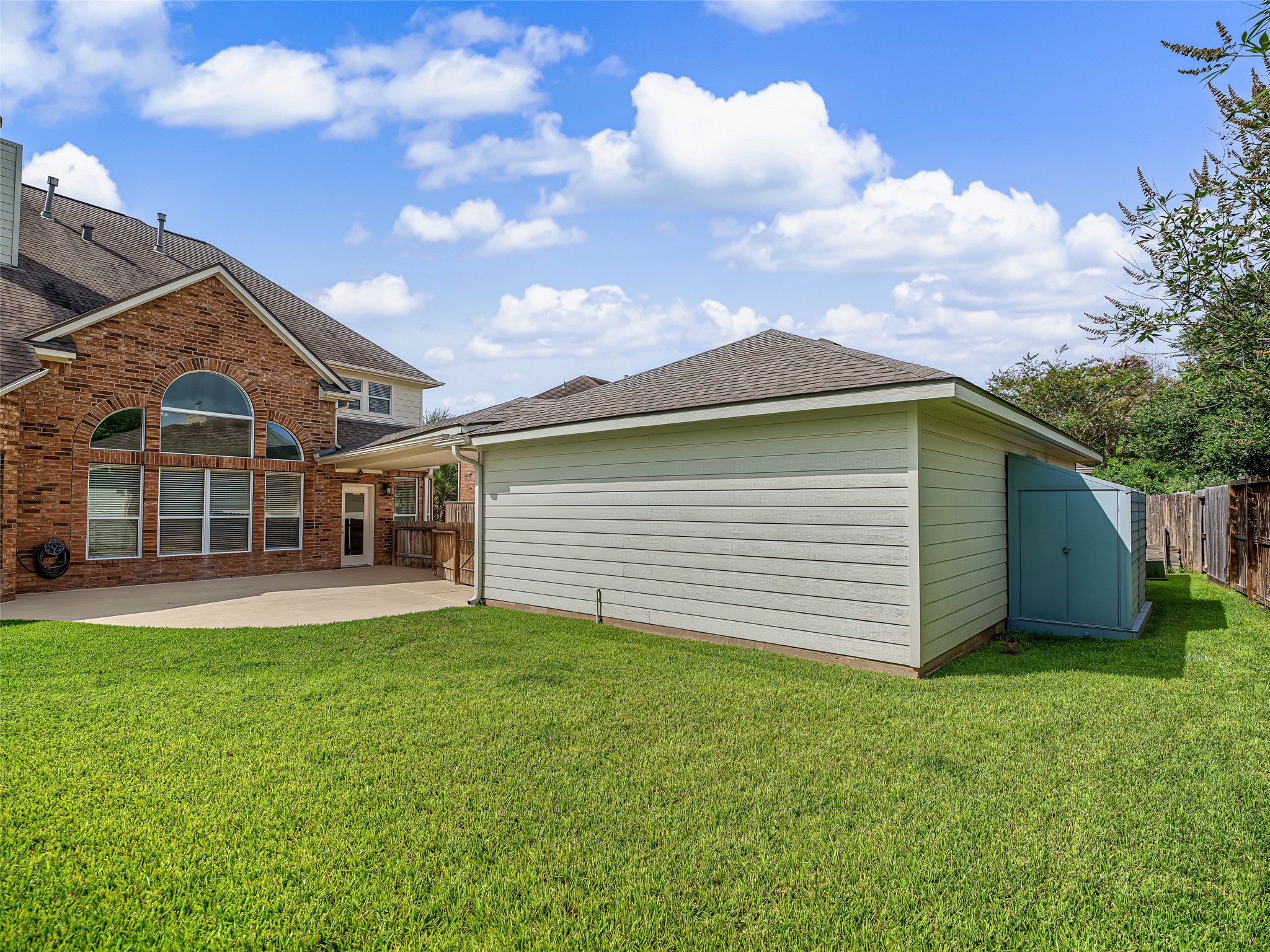 2210 Fox Path Katy, TX 77494 - Photo 44 of 47 Tucked neatly along the back side of the garage is a dedicated, matching storage unit with locking double doors.