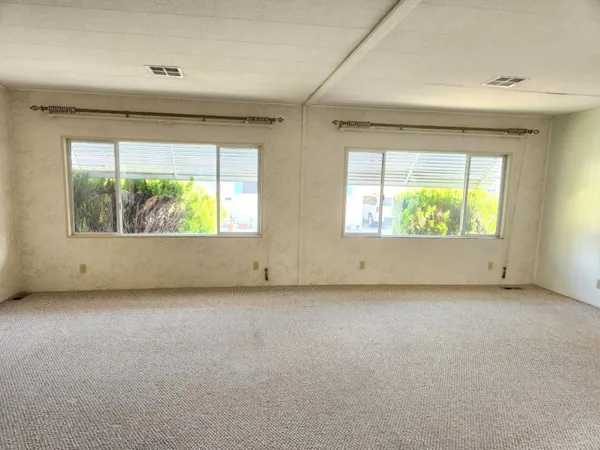 an empty room with windows