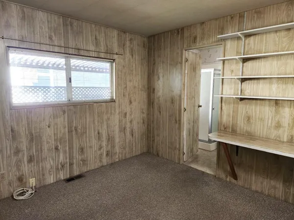 a bathroom with a double vanity sink mirror and shower