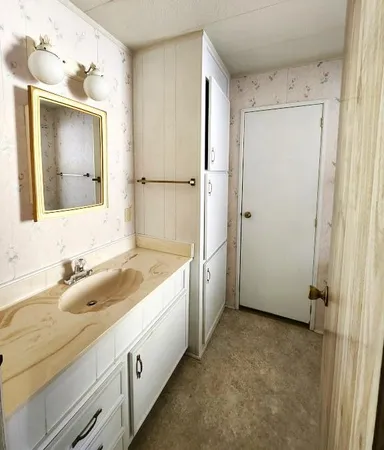 a bathroom with a toilet a sink and a shower