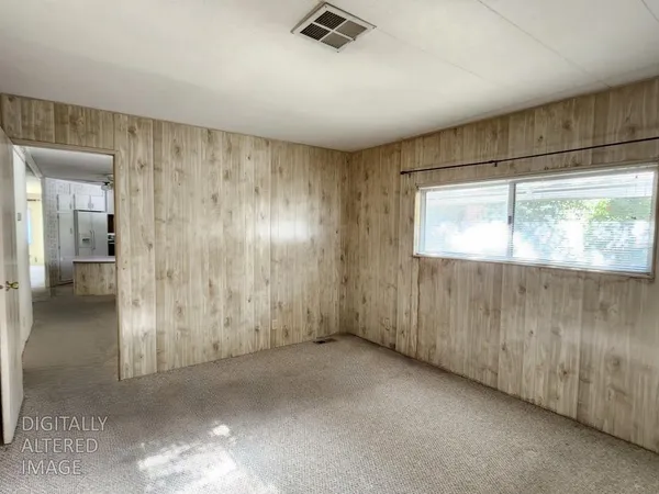 a view of an empty room and window