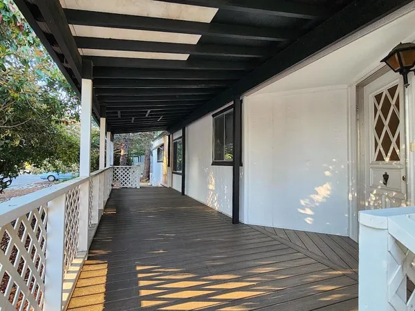 a view of porch with wooden floor