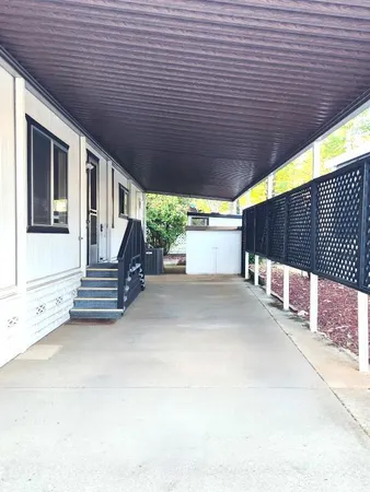 a view of a porch with wooden floor