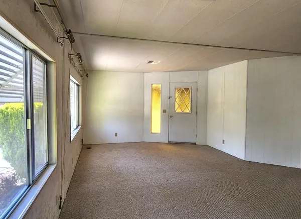 a view of empty room with windows