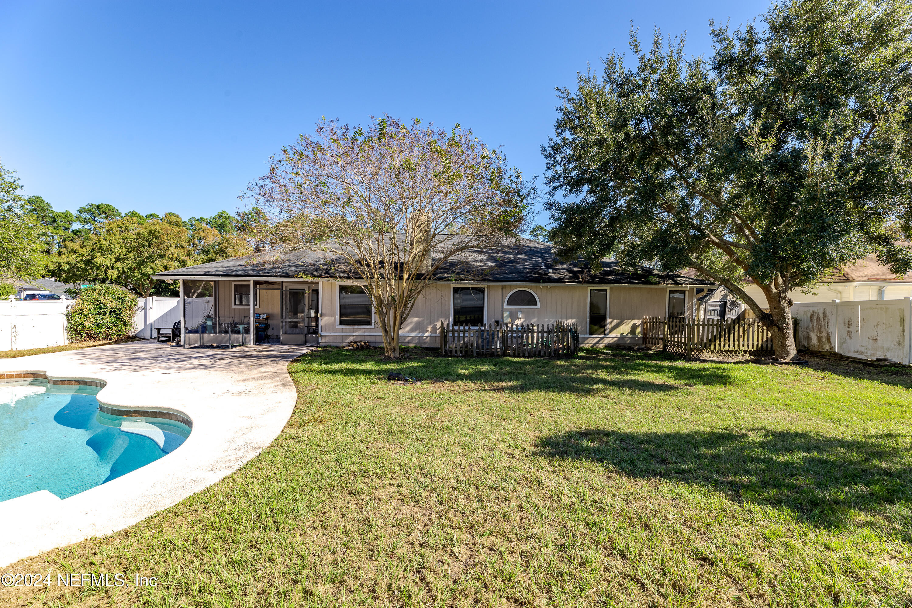 1646 Rusty Rail Road Jacksonville, FL 32225 - Photo 14 of 31 a front view of a house with swimming pool having outdoor seating