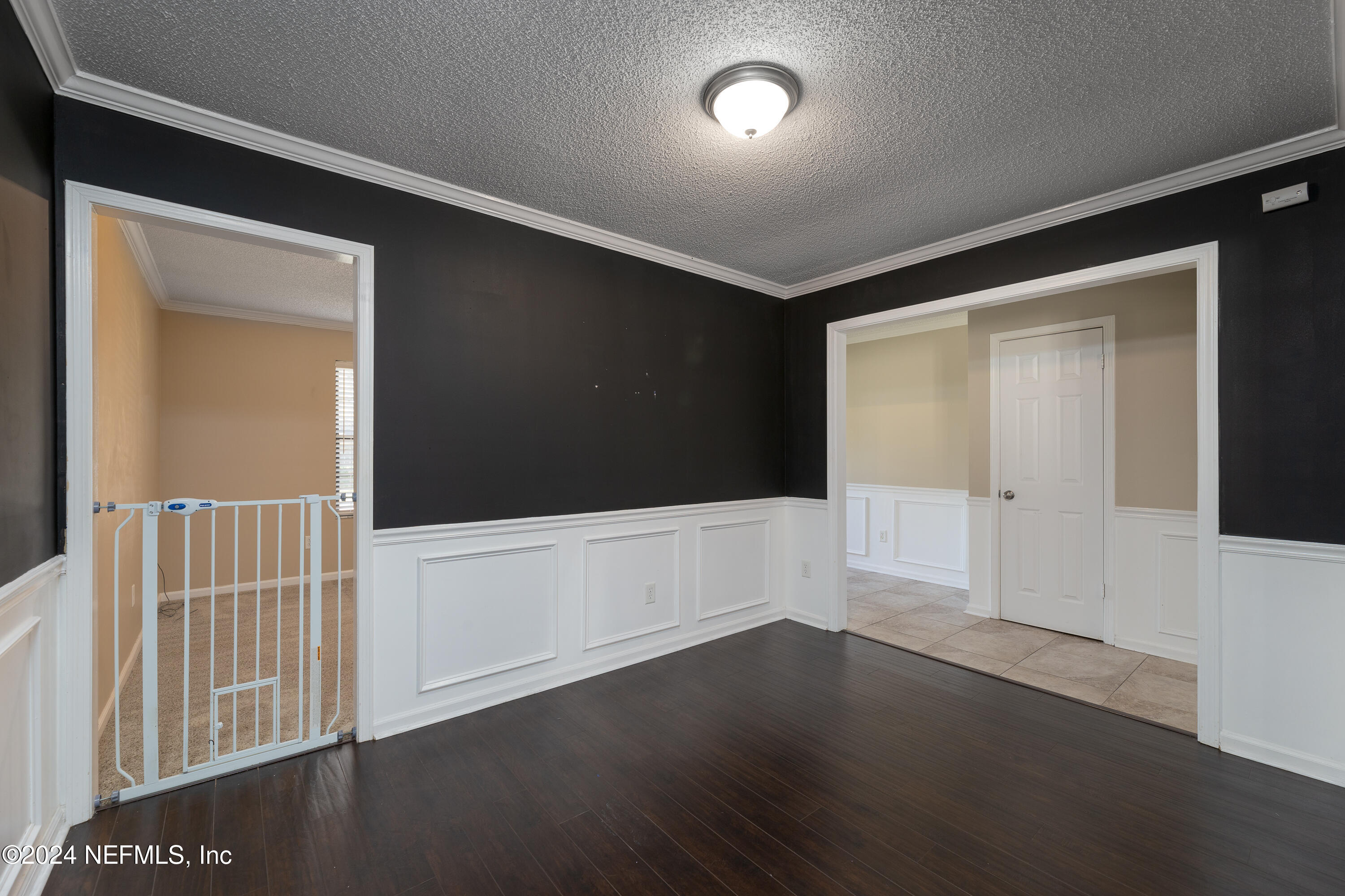 1646 Rusty Rail Road Jacksonville, FL 32225 - Photo 23 of 31 an empty room with wooden floor