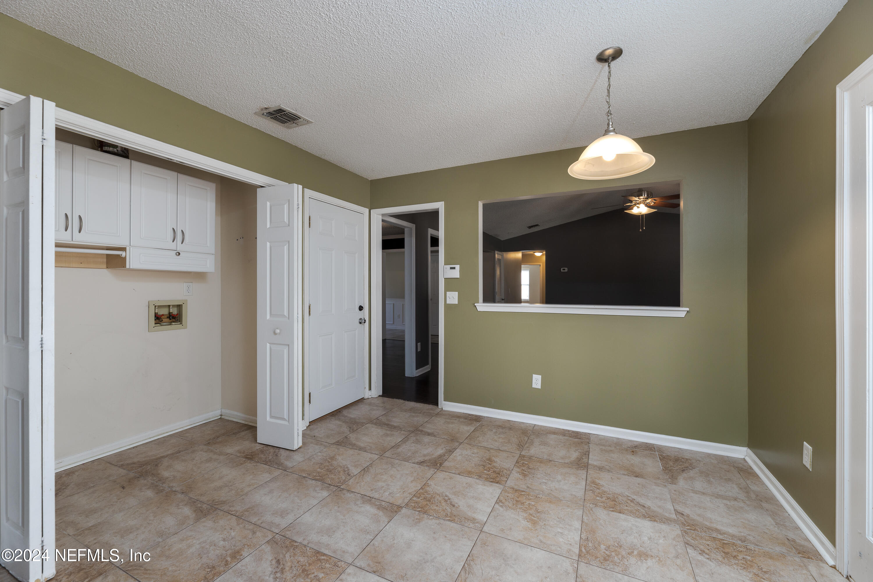 1646 Rusty Rail Road Jacksonville, FL 32225 - Photo 24 of 31 a view of a livingroom with wooden floor and cabinets
