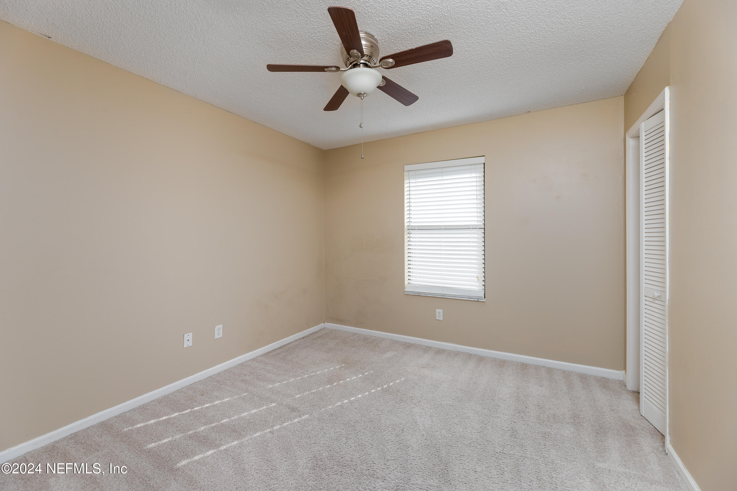 1646 Rusty Rail Road Jacksonville, FL 32225 - Photo 28 of 31 a view of an empty room with a window