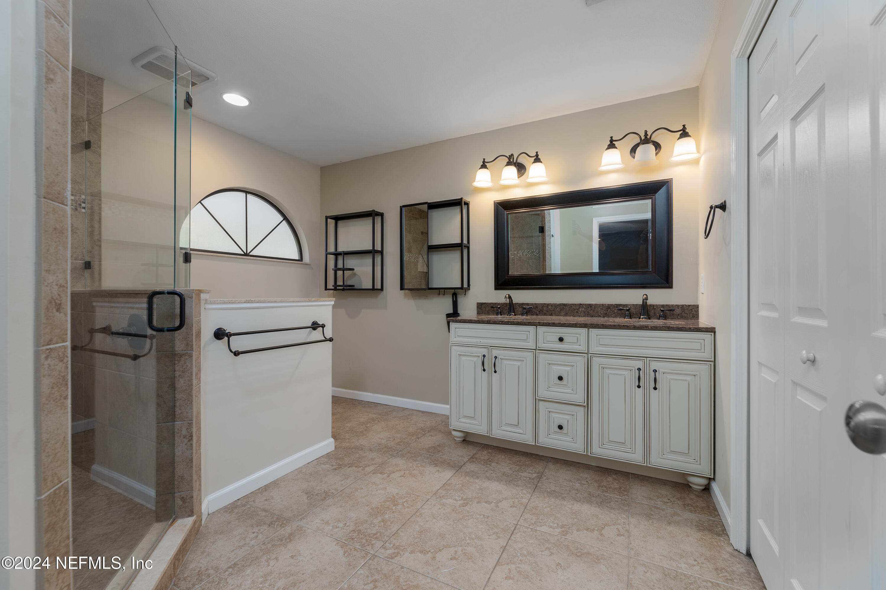 1646 Rusty Rail Road Jacksonville, FL 32225 - Photo 8 of 31 a spacious bathroom with a sink and a mirror