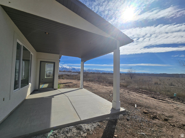 1651 West Ross Road Syracuse, UT 84075 - Photo 4 of 15 View of patio featuring a mountain view
