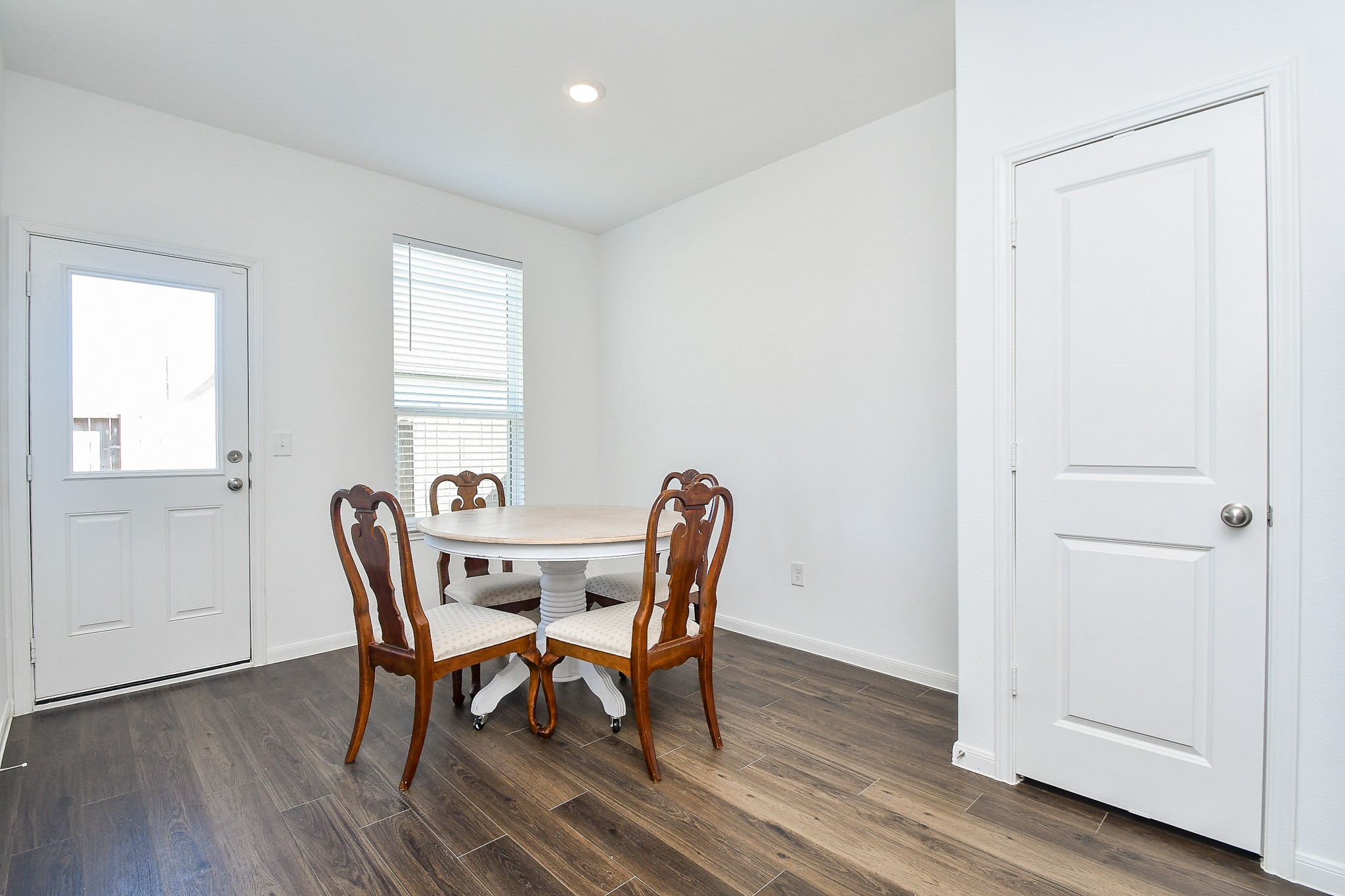 17826 Juneberry Seed Street Hockley, TX 77447 - Photo 20 of 35 a view of a dining room with furniture and wooden floor