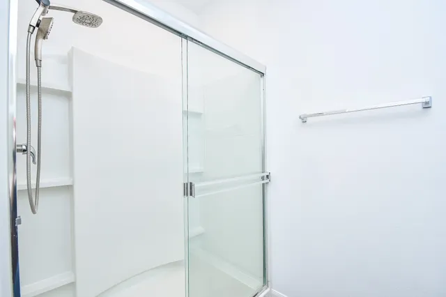 a bathroom with a sink toilet and mirror