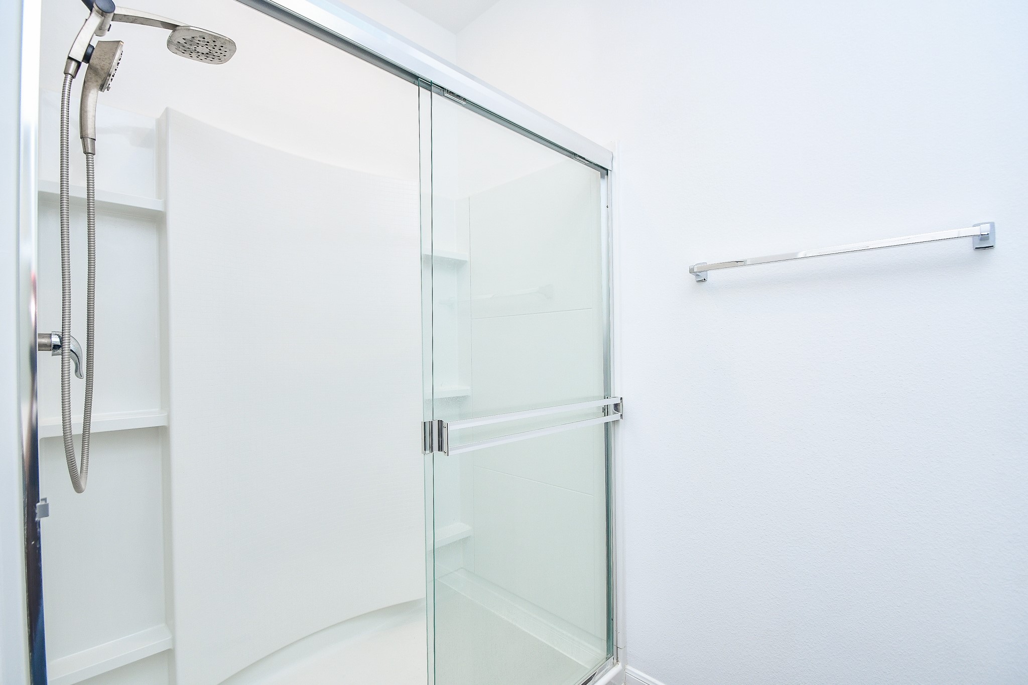 17826 Juneberry Seed Street Hockley, TX 77447 - Photo 23 of 35 a bathroom with a glass shower door