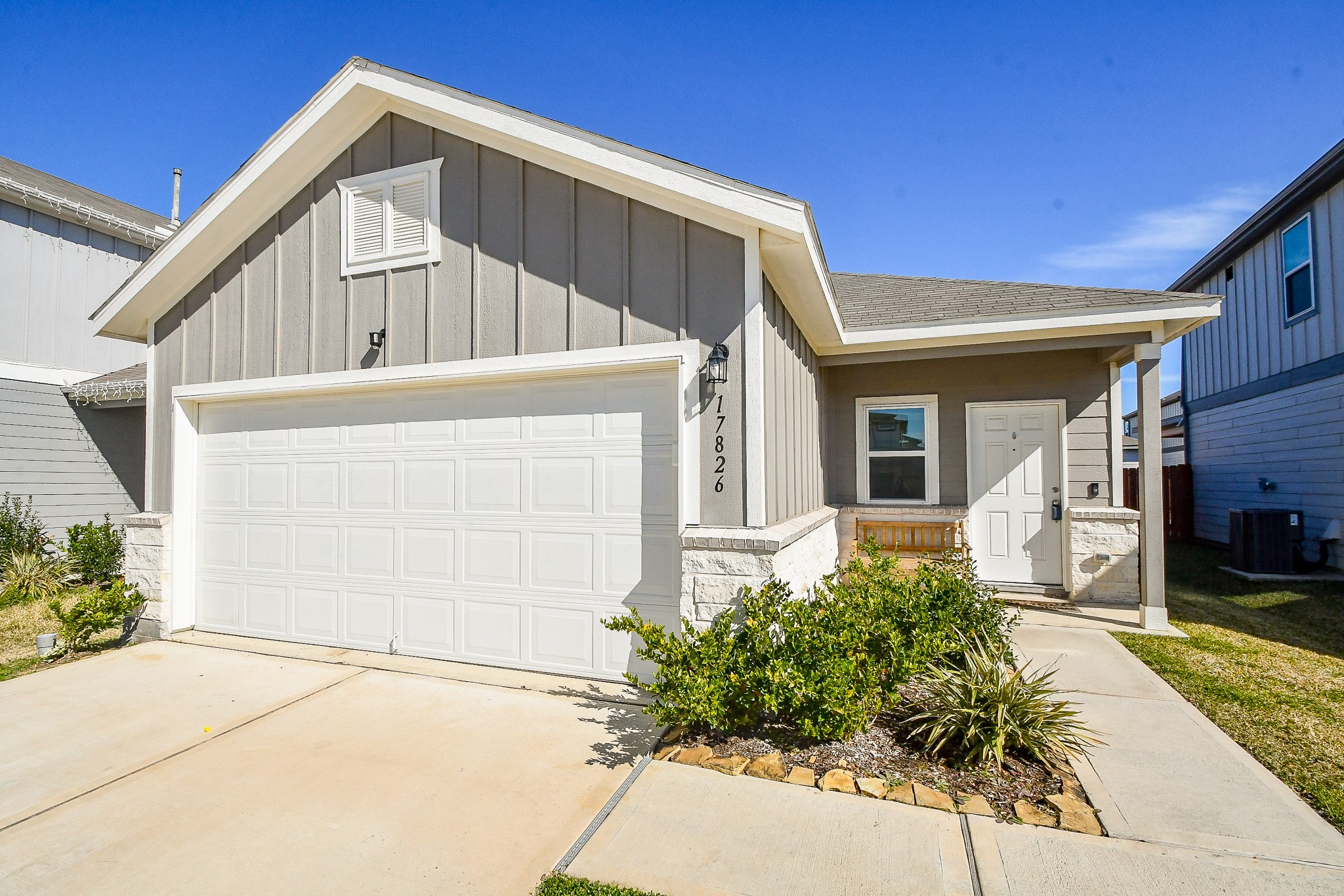 17826 Juneberry Seed Street Hockley, TX 77447 - Photo 3 of 35 a front view of a house with a yard
