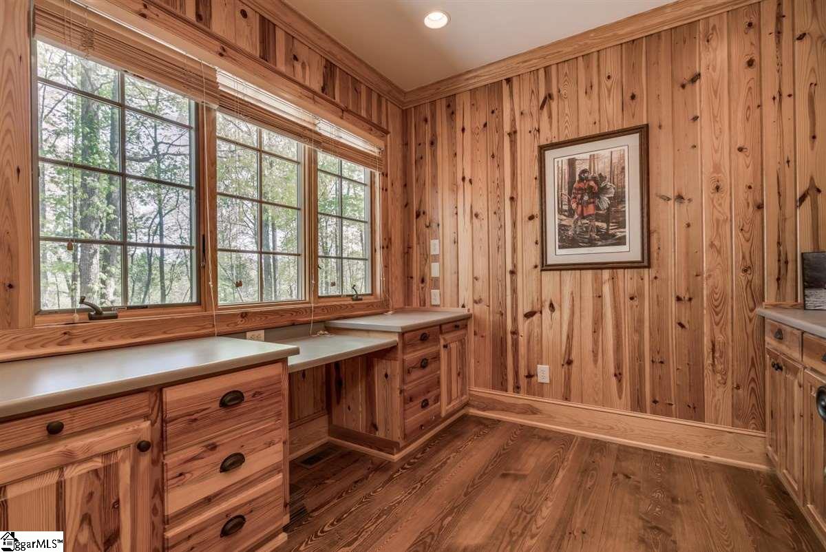 185 Hemlock Cove Road Sunset, SC 29685 - Photo 13 of 36 Home office - no extra furniture needed. Need a mental break while working? Enjoy the view of Mother Nature in the wall to wall windows. Office is located in a private area near the exit door to the rear porch.