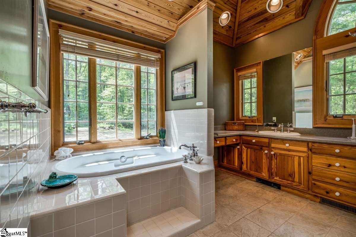 185 Hemlock Cove Road Sunset, SC 29685 - Photo 16 of 36 Jetted tub with a view and surrounding counter space for candles to make sure you have the ultimate spa experience.