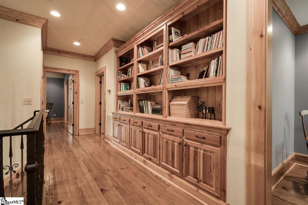 185 Hemlock Cove Road Sunset, SC 29685 - Photo 19 of 36 Extra large, custom bookcase at the top of the stairs.