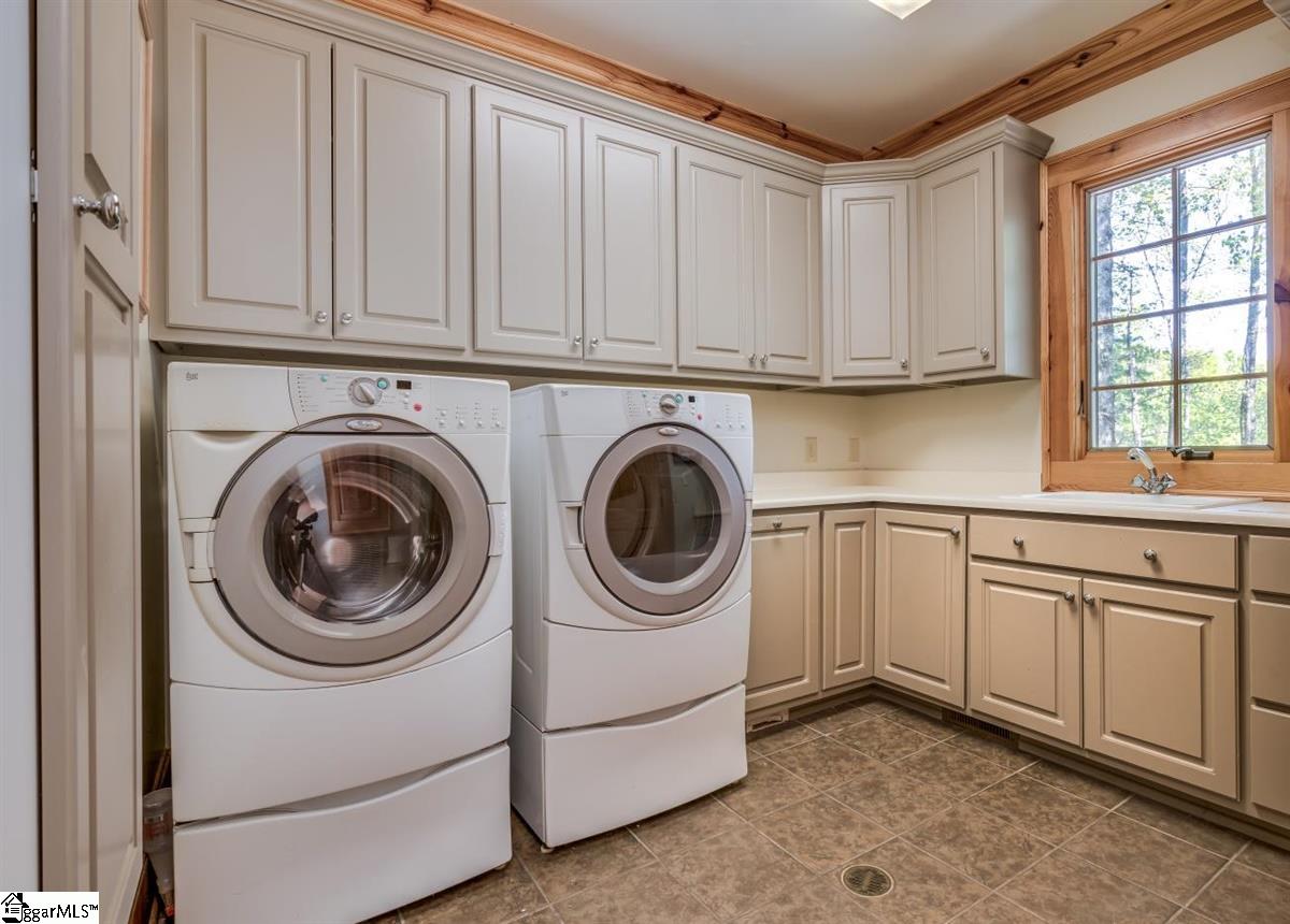 185 Hemlock Cove Road Sunset, SC 29685 - Photo 25 of 36 Large laundry room with space to take care of all your laundry needs. The garage entrance is just outside the laundry room.