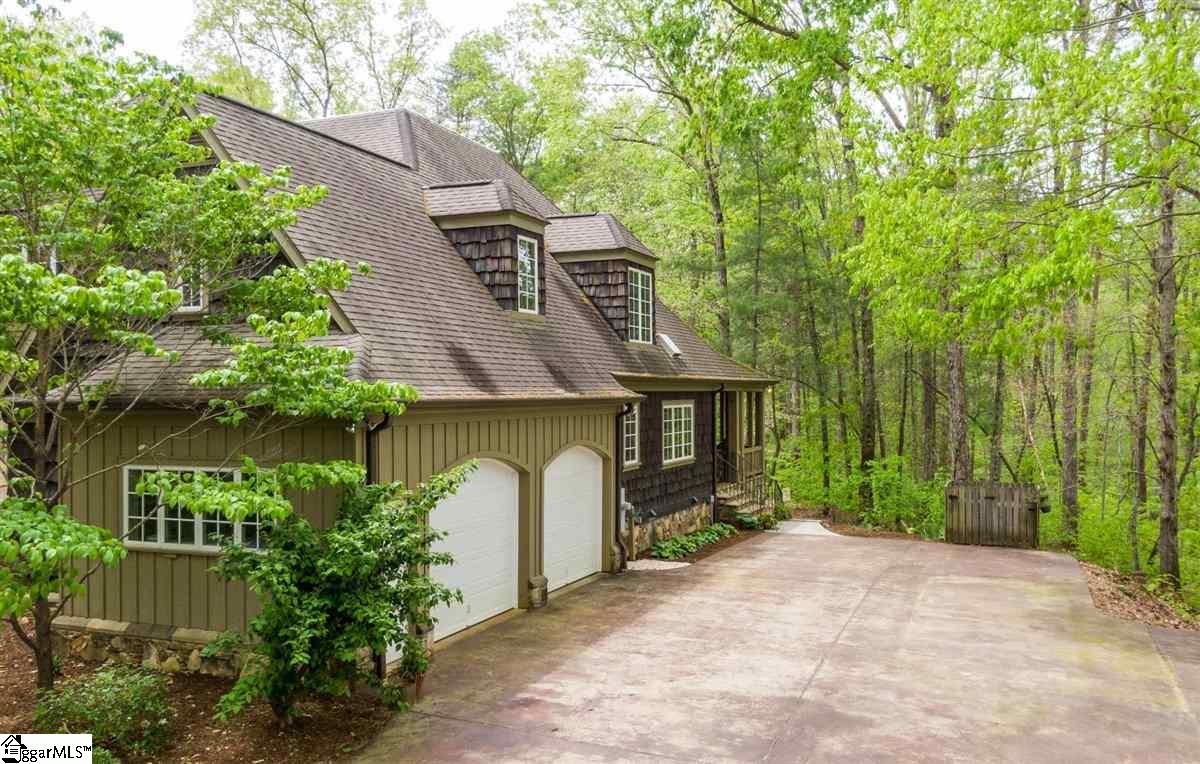 185 Hemlock Cove Road Sunset, SC 29685 - Photo 29 of 36 Double garage with extra storage and extra parking spaces too. There is an entry from the garage into the house near the laundry room. A 3rd garage enters from the rear of the house into the basement area.