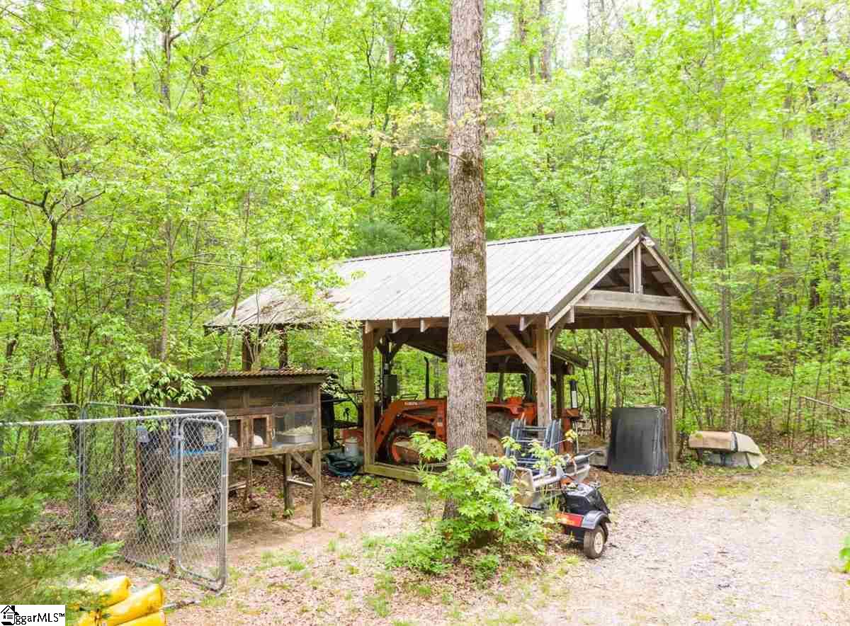 185 Hemlock Cove Road Sunset, SC 29685 - Photo 33 of 36 Outbuilding provides shelter for large lawn equipment.