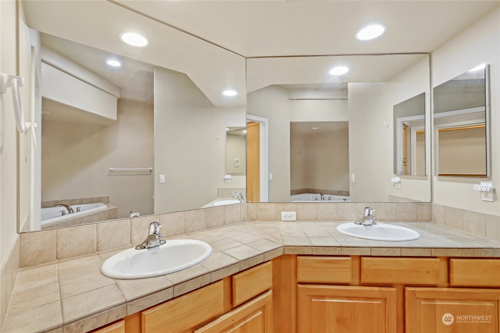80 Cascadia Loop Sequim, WA 98382 - Photo 20 of 40 a bathroom with a granite countertop sink a mirror and a shower