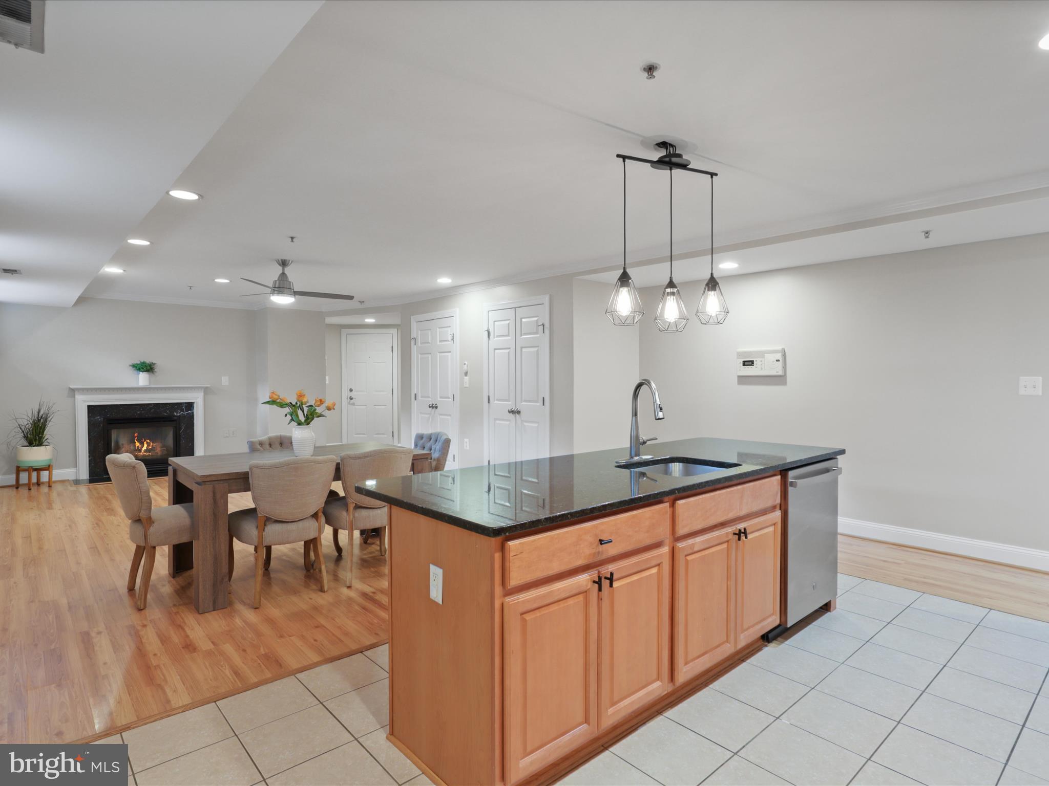 1300 Taylor Street Northwest, Unit 4 Washington, DC 20011 - Photo 14 of 35 a kitchen with a sink dining table and chairs