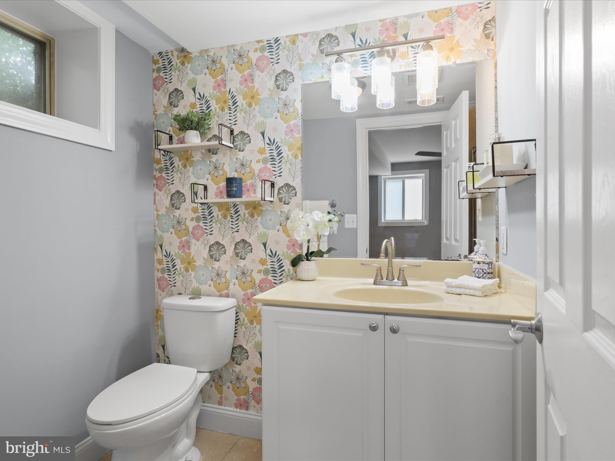 1300 Taylor Street Northwest, Unit 4 Washington, DC 20011 - Photo 20 of 35 a bathroom with a sink a toilet and shower curtain