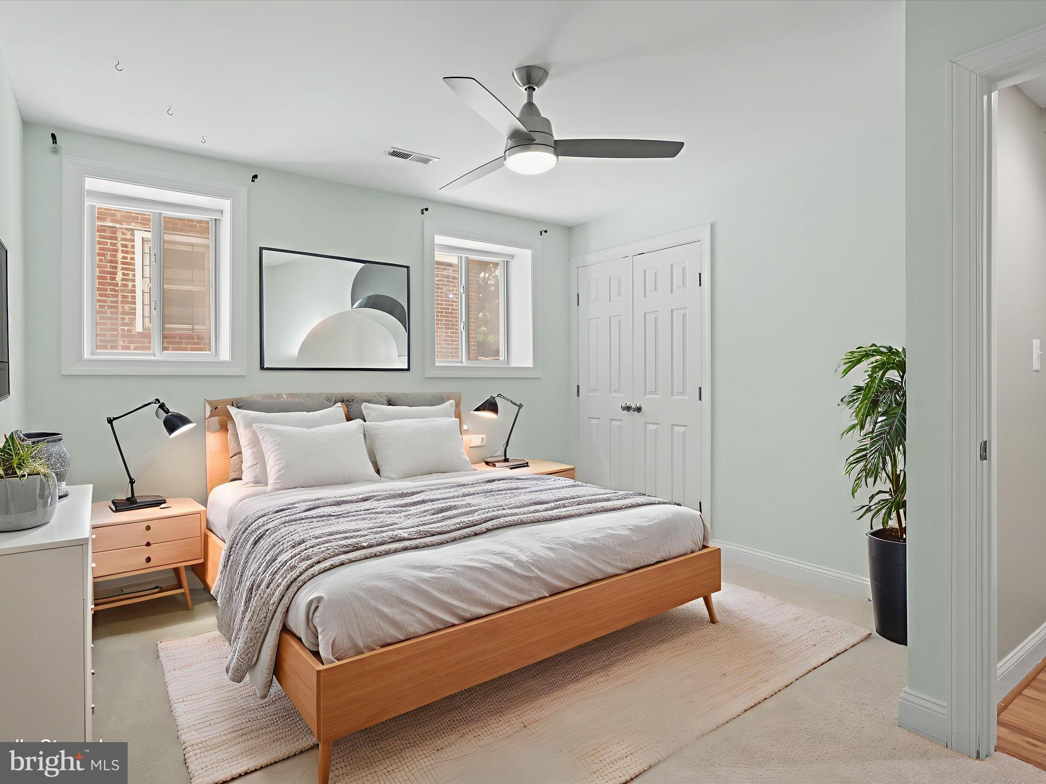 1300 Taylor Street Northwest, Unit 4 Washington, DC 20011 - Photo 21 of 35 a bedroom with a bed and a potted plant