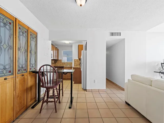 a view of a livingroom with furniture and entryway