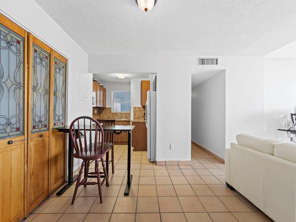 a view of a livingroom with furniture and entryway