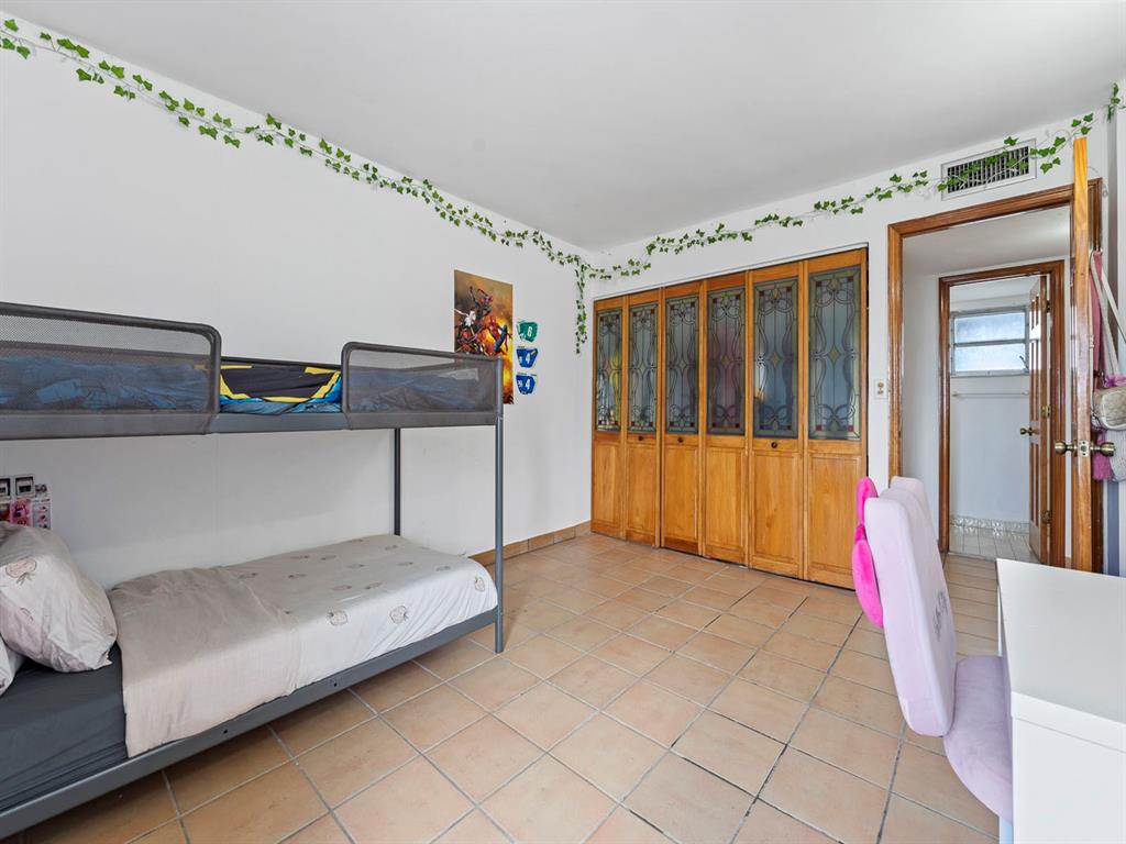 310 Fontainebleau Boulevard, Unit 502 Miami, FL 33172 - Photo 12 of 24 a living room with furniture