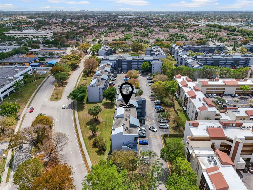310 Fontainebleau Boulevard, Unit 502 Miami, FL 33172 - Photo 22 of 24 an aerial view of a houses with a swimming pool