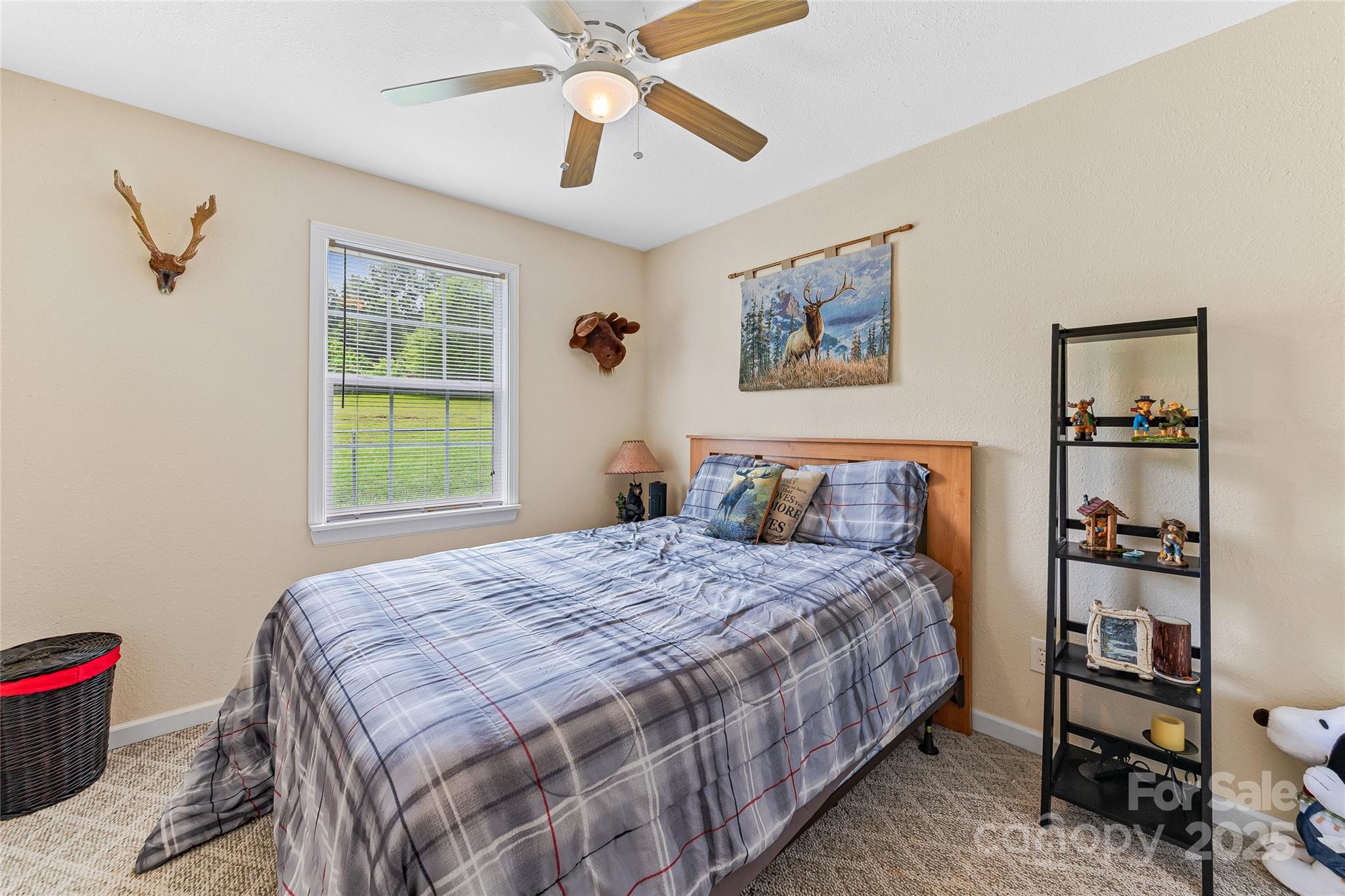 410 Lewis Road Rutherfordton, NC 28139 - Photo 20 of 23 a bedroom with a bed and a chandelier