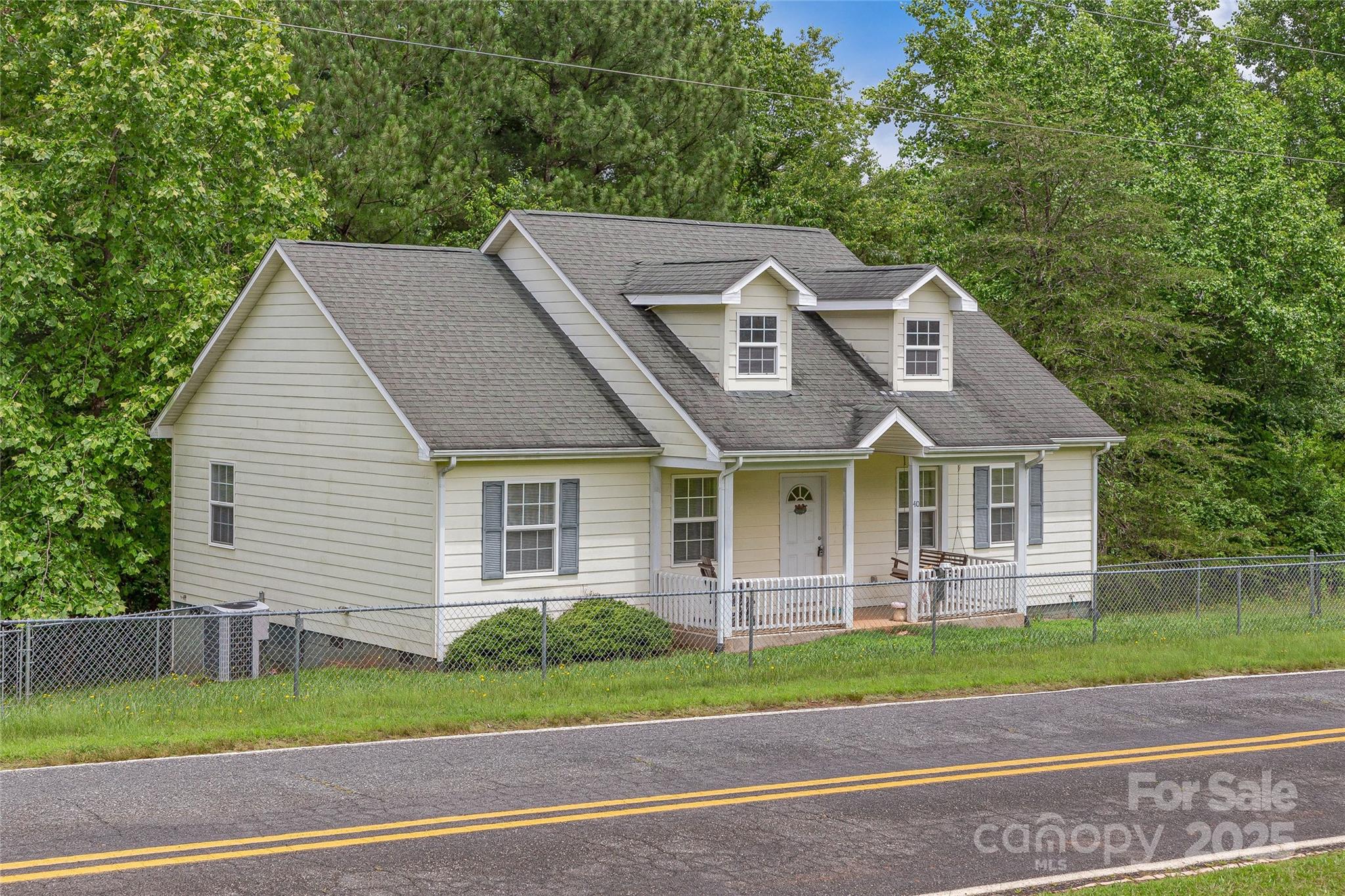 410 Lewis Road Rutherfordton, NC 28139 - Photo 2 of 23 a front view of a house with a yard and garage