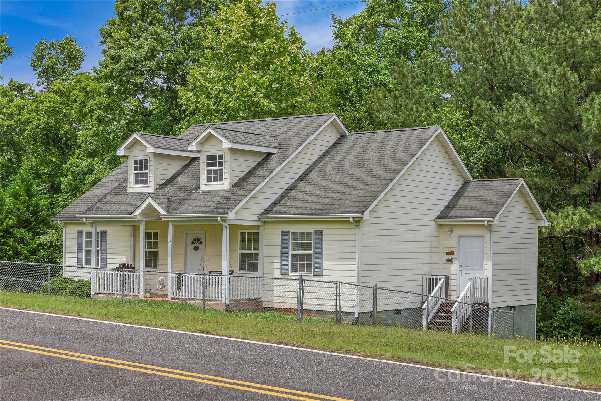 410 Lewis Road Rutherfordton, NC 28139 - Photo 3 of 23 a front view of a house with a yard