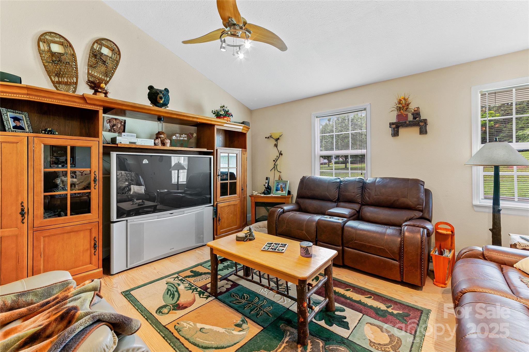 410 Lewis Road Rutherfordton, NC 28139 - Photo 6 of 23 a living room with furniture a flat screen tv and a window