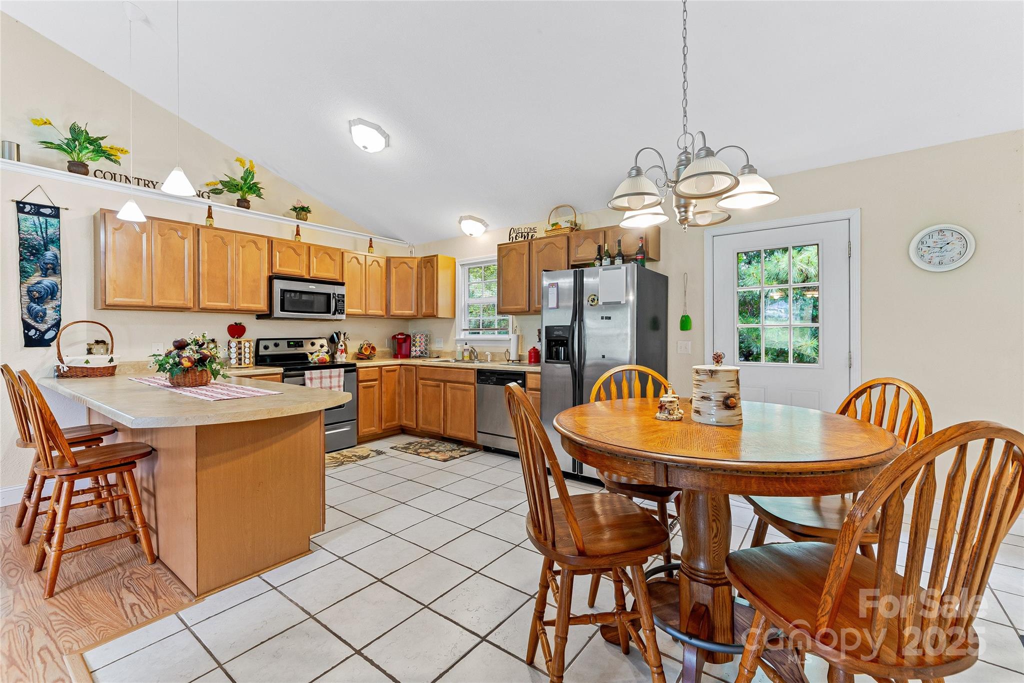 410 Lewis Road Rutherfordton, NC 28139 - Photo 10 of 23 a dining room filled counter top space and a dining table with kitchen view