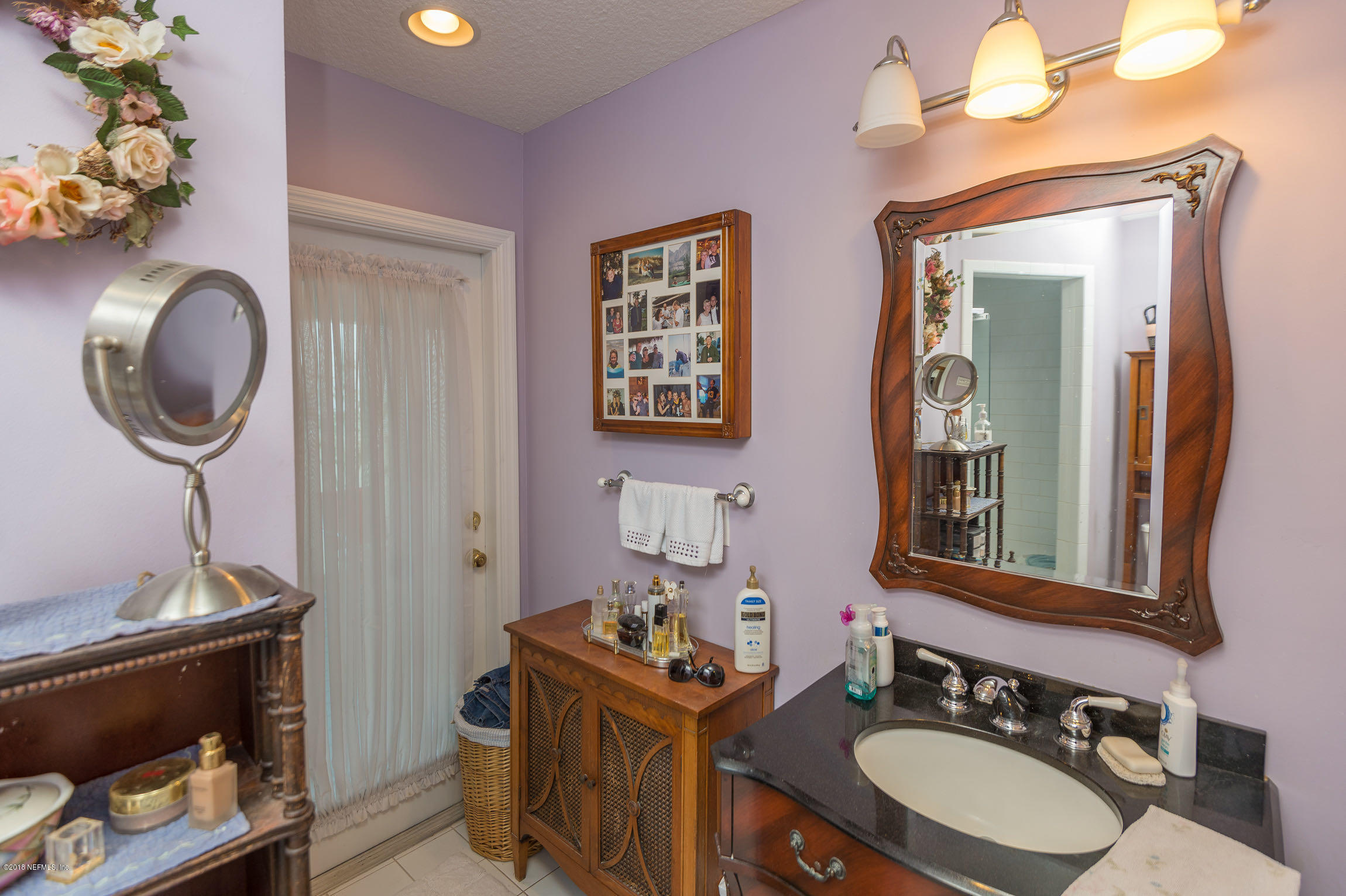 214 Hopkins Street Neptune Beach, FL 32266 - Photo 34 of 58 Vanity and Door to Outdoor Space
