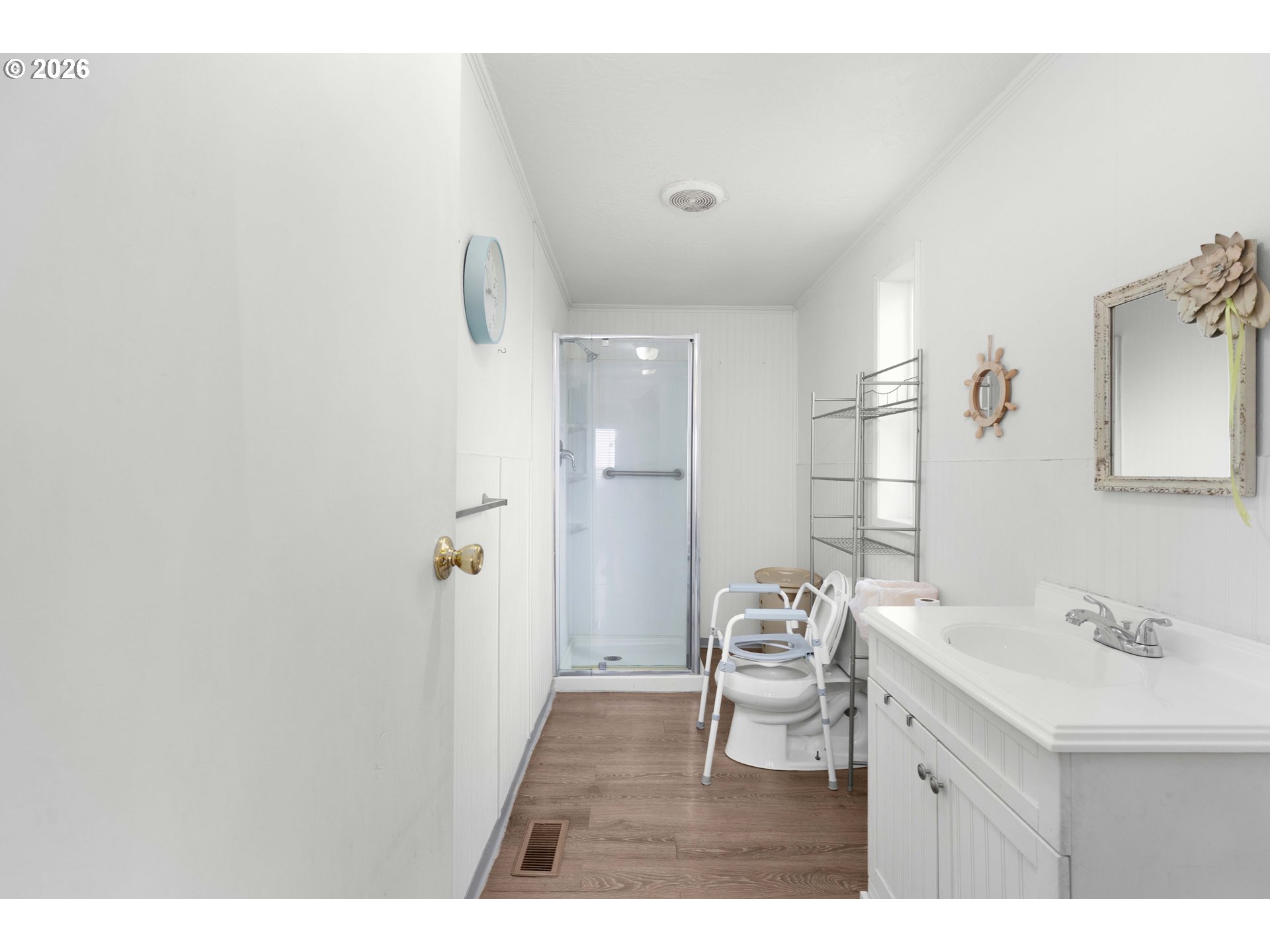 583 Suncrest Street Myrtle Creek, OR 97457 - Photo 15 of 24 a bathroom with a sink mirror and a shower