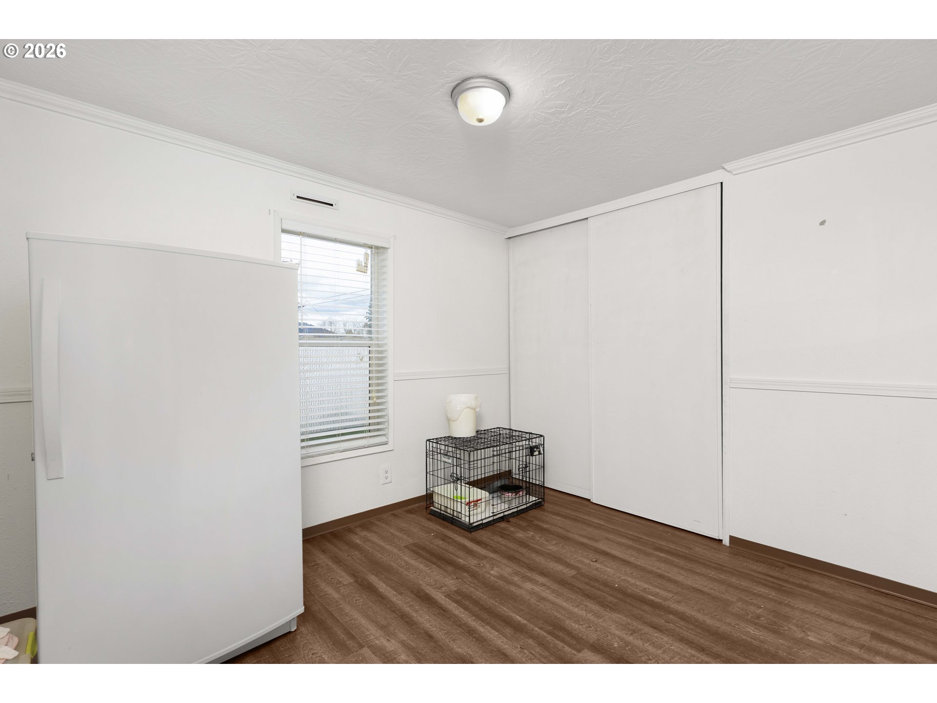 583 Suncrest Street Myrtle Creek, OR 97457 - Photo 19 of 24 a view of empty room with wooden floor