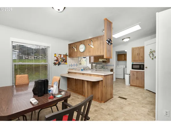 a kitchen with a sink stove and microwave