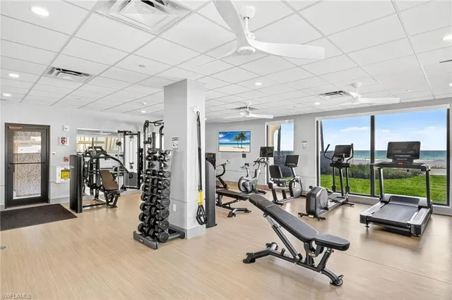 a view of swimming pool with outdoor seating and plants