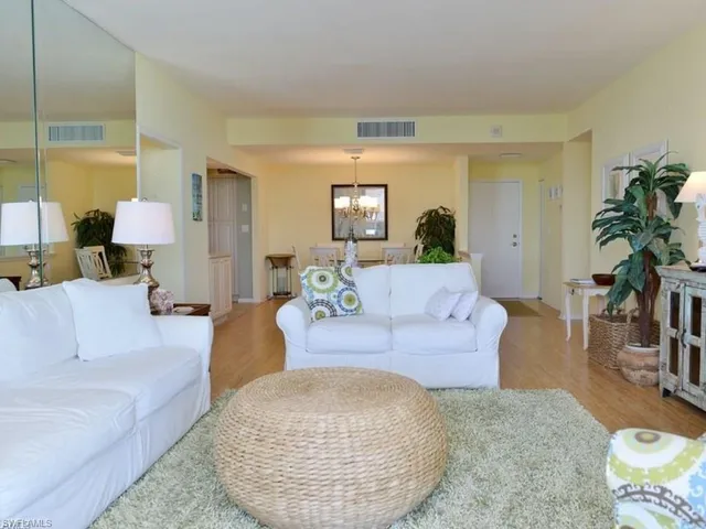 a kitchen with white cabinets sink and white appliances