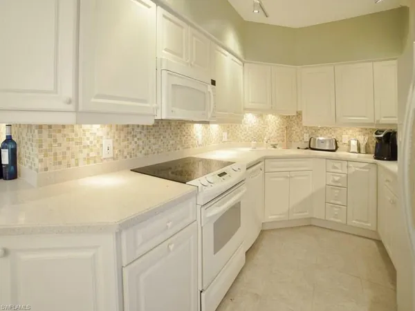 a view of a kitchen with a sink