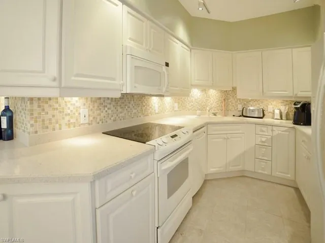a view of a kitchen with a sink