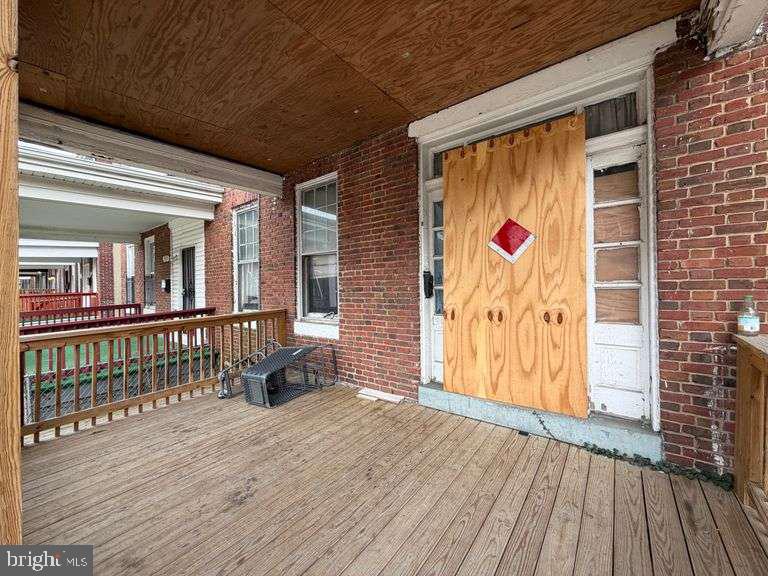 3923 Ridgewood Avenue Baltimore, MD 21215 - Photo 2 of 18 a view of front door of house with wooden floor