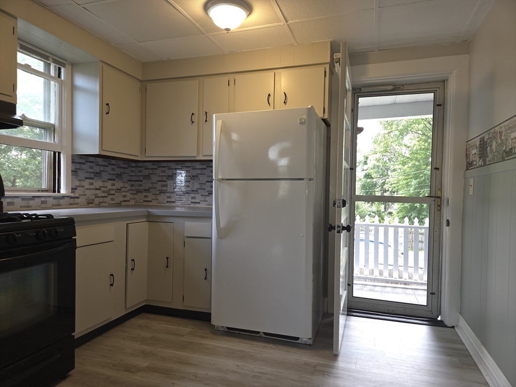 29 Marion Street, Unit 2 Chicopee, MA 01013 - Photo 1 of 1 a white refrigerator freezer sitting inside of a kitchen