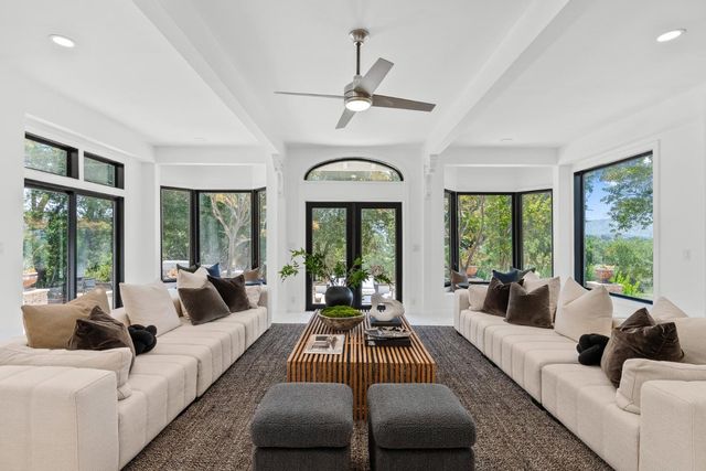 a kitchen with stainless steel appliances granite countertop a sink and cabinets