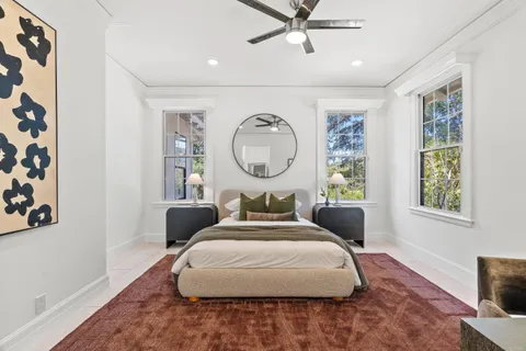 a view of a backyard with sitting area