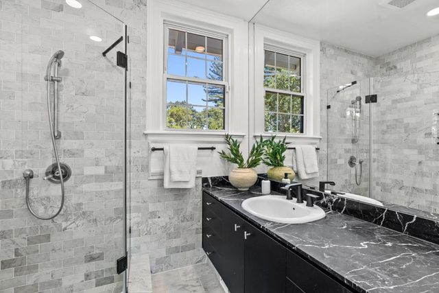 a large kitchen with a stove and a sink